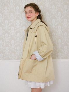 This is chat de lama’s Hooded Trench Coat, featuring a wearable and cute silhouette. It's designed to be worn either in a classic or cute style by utilizing a detachable hood. The hood is attached with snap buttons for easy removal. Real leather stoppers are added to the hood strings for a classic touch. The inner fabric features a striped pattern, adding a lively touch to the sleeves when rolled up. - Perfect for daily wear- Can be styled with various looks for different styles- A versatile item that complements any outfit well- Can be opened or closed with both a zipper and buttons at the front Beige Cotton Outerwear With Double-lined Hood, Beige Hooded Everyday Outerwear, Beige Hooded Outerwear For Everyday, Beige Spring Outerwear With Double-lined Hood, Casual Beige Outerwear With Detachable Hood, Cute Silhouette, Trench Coat Beige, Hooded Trench Coat, Cute Style