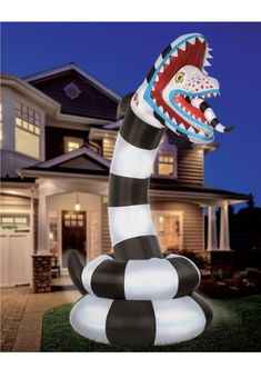 a large inflatable snake is on the lawn