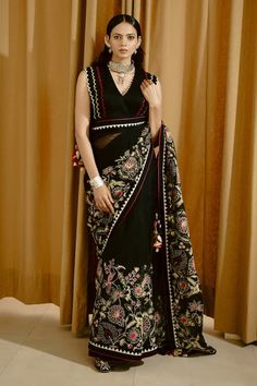 Black saree with aari thread embroidered floral motifs and scalloped border. Comes with padded scalloped border blouse. - Aza Fashions Elegant V-neck Choli With Resham Embroidery, Traditional V-neck Sharara For Party, Designer V-neck Choli With Resham Embroidery, V-neck Blouse Piece For Diwali Reception, Festive V-neck Georgette Blouse Piece, Festive Black V-neck Sets, Traditional V-neck Sharara For Eid, Elegant V-neck Traditional Wear With Pallu, Elegant Lehenga With Resham Embroidery And V-neck