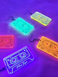 glow in the dark keychains with cassette tapes on them