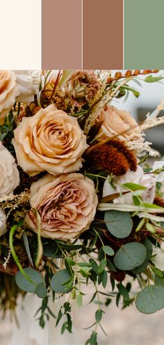 a vase filled with lots of flowers on top of a table