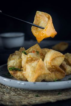 a plate with some food on it and chopsticks sticking out of the top