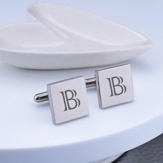 These classicaclly customized cufflinks are a great gift for any man. They look great on the groom, groomsman, or father of bride or groom! Each cufflink is engraved with a single initial. CUSTOM ENGRAVING: BOTH CUFFLINKS: [Initial] DETAILS: MATERIAL: stainless steel SHAPES: round or square FINISHES: gold, gunmetal, rose gold, stainless steel DIMENSIONS: 5/8 inch Elegant Engraved Cufflinks For Business, Timeless Silver Cufflinks For Wedding, Classic Personalized Jewelry For Business, Classic Rectangular Cufflinks For Father's Day, Elegant Engraved Cufflinks As Gift, Luxury Rectangular Cufflinks For Wedding, Silver Cufflinks With Engraving Option For Gift, Elegant Rectangular Cufflinks For Father's Day, Elegant White Gold Cufflinks As Gift