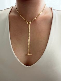 18k gold plated paperclip lariat y necklace with a toggle front clasp. Necklace drop can be adjustable and tailored to your liking. Necklace can be worn in multiple ways. You can opt to have a drop which gives it a lariat look or you can opt not to have a drop which give you a regular toggle front necklace look. It is of great importance to me that I make jewelry for my customers that I, myself, wear every day. Each jewelry piece is handmade by me personally with love and care. Each item is craf Everyday Lariat Chain Necklace With Toggle Clasp, Gold Lariat Necklace With Toggle Clasp, Gold Toggle Necklace With Paperclip Shape, Lariat Necklace With Toggle Clasp, Gold Lariat Necklace With Lobster Clasp, Adjustable Chain Lariat Toggle Necklace, Yellow Gold Lariat Toggle Necklace, Gold Lariat Toggle Necklace With Adjustable Chain, Minimalist Lariat Toggle Necklace As A Gift