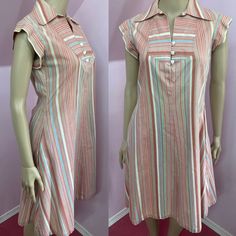 "Adorable 1970s striped a-line dress has Wide collar inside hip pockets, capped sleeves & buttons down bodice. Fabric is cotton and has white, shades of brown, green and aqua blue stripes. White plastic heart buttons. Interfacing has some puckering otherwise, Overall Excellent Condition Freshly washed No label (appears to be house made) Fits XS/S Measurements are Bust 34\" Waist 32\" Hips 46\" Shoulders 14.5\" Sleeves 2.25\" Length 37.5\" Sweep @70\"" Retro Striped Lined Dress, Vintage Striped Sleeveless Dress, Retro Striped Knee-length Dress, Retro Striped Dresses With Buttons, Striped Retro Dresses With Buttons, Vintage Short Sleeve Striped Dress, 1970s Outfits, Retro Summer Dress, Aqua And Green