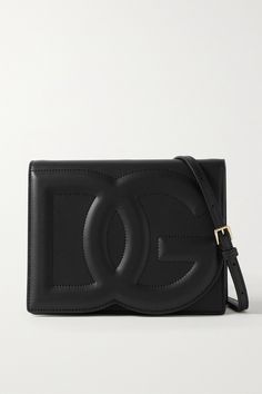 Dolce & Gabbana's bag has been made in Italy from sleek black leather and has a slim, structured silhouette with the label's embossed monogram at the front. It comes with a detachable shoulder strap, so you can wear it cross-body or as a clutch on nights out. The interior fits your phone, cardholder and lipstick for touch-ups. Designer Crossbody Shoulder Bag With Logo Plaque, Luxury Evening Shoulder Bag With Embossed Logo, Designer Crossbody Bag With Logo Plaque, Luxury Crossbody Bag With Logo Plaque, Designer Rectangular Bag With Logo Plaque, Elegant Leather Bags With Logo, Formal Crossbody Bag With Logo Plaque, Luxury Evening Bags With Embossed Logo, Evening Shoulder Bag With Embossed Logo