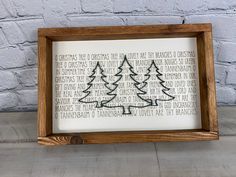 a wooden frame with a christmas tree on it