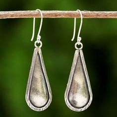 Artisan Chanatip Na Lampoon of Thailand handcrafts these beautiful drop-shaped dangle earrings. The artisan uses 950 silver from the hill tribes of Thailand to create the simple design. Traditional Handmade Sterling Silver Teardrop Earrings, Artisan Silver Teardrop Earrings, Traditional Nickel-free Sterling Silver Teardrop Earrings, Unique Teardrop Oxidized Earrings, Unique Teardrop Earrings With Oxidized Finish, Artisan Drop Earrings, Artisan Silver Long Drop Earrings, Artisan Long Drop Silver Earrings, Artisan Long Drop Nickel-free Earrings