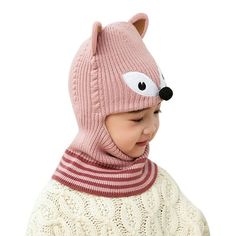 a small child wearing a pink hat and scarf