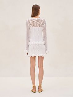 The Kistsa Dress showcases an open-knit design with intricate crochet work, complete with a removable slip for added versatility. A scoop neckline and long sleeves add a touch of romance, while the scalloped edges and floral patterns exude femininity. Intricate Crochet, Crochet Work, Skirt Jumpsuit, Scalloped Edges, Open Knit, Floral Patterns, Instagram Shop, Knitting Designs, Skirt Pants