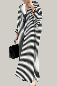 Effortlessly stylish and sophisticated, this striped oversized shirt dress is perfect for the warmer seasons. With a button front, a split neckline, and a high waistline, it exudes elegance and class. The long sleeves and drop shoulder design add a touch of artistry, while the straight hem and non-stretch fabric provide a luxurious finish. Perfect for the fashion-forward and discerning consumer. 95% Polyester, 5% Elastane Please allow 3-5 business days to process and ship. Product Measurements in cm : Size US Bust Length Sleeve Length Cuff S 4 90 130 72 31 M 6 94 131 73 32 L 8/10 100 132 74 33.5 XL 12 106 133 75 35 Chic Oversized Maxi Dress, Casual Oversized Striped Dresses, Chic Long Striped Dress, Elegant Striped Shirt Dress For Vacation, Striped Long Sleeve Maxi Dress For Work, Striped Long Sleeve Maxi Dress For Vacation, Striped Long Sleeve Maxi Dress For Daywear, Oversized Striped Spring Dresses, Striped Long Sleeve Shirt Dress For Daywear