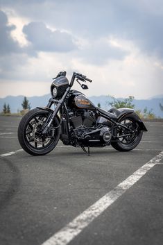 a black motorcycle parked in a parking lot