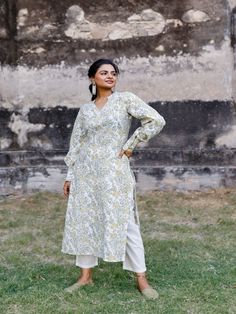 White & Mustard Floral Hand Block Printed Pant Kurta Set (Set of 2) by Pheeta now available at Trendroots Straight Kurta With Set-in Sleeves For Spring, Traditional Spring Kurta With Set-in Sleeves, Cotton Kurta With Set-in Sleeves For Eid, Spring Block Print Salwar Kameez With Straight Kurta, Long Sleeve Cotton Salwar Kameez With Floral Print, Eid Floral Print Kurta, Mulmul Straight Kurta With Floral Print, Floral Print Mulmul Straight Kurta, Traditional Long Sleeve Kurta With Relaxed Fit