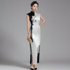 Traditional White Cheongsam With Stand Collar, White Fitted Cheongsam With Stand Collar, Fitted Embroidered White Cheongsam, Traditional White Fitted Cheongsam, Traditional White Cheongsam For Spring, Elegant Long White Ao Dai, Fitted White Ao Dai With Stand Collar, White Long Cheongsam For Spring, Casual Qipao