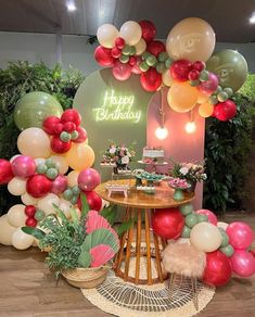 a birthday party with balloons and decorations