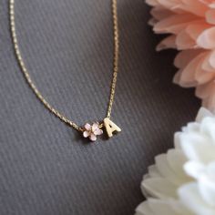 Personalized Cherry Blossom and initial necklace in gold. ▶▶ You can also add more letters from following link. https://www.etsy.com/listing/229265692/brushed-finish-letters-alphabet-monogram ▶ Material - Gold plated over brass ▶ Chain Length - 14 ~ 20 inches adjustable. ▶ Measure - Flower 6mm Letter H 7mm x W. 5mm ▶The matching bracelet available from following link. https://www.etsy.com/listing/191406481/cherry-blossom-bracelet-pink-flower https://www.etsy.com/listing/842121728/personalized-ch Pink Dainty Jewelry For Personalized Gifts, Dainty Pink Jewelry For Personalized Gift, Elegant Personalized Pink Charm Necklace, Cute Gold Name Necklace For Mother's Day, Delicate Personalized Flower Necklace, Elegant Pink Initial Pendant Necklaces, Pink Initials Jewelry As A Gift, Pink Initials Jewelry Gift, Personalized Cute Rose Gold Necklace