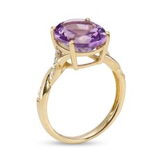 Dress to impress with this oval purple amethyst and diamond twist shank ring, a vibrant and inviting look that draws all the right kinds of attention. Crafted in warm 10K gold This choice glistens with a faceted 12.0 x 10.0mm oval-shaped bright purple amethyst at the center. The split shank shimmers with a twist of diamond-lined and polished ribbons. This design shines with 1/15 ct. t.w. of diamonds. Available in size 7 only Oval Purple Diamond Ring With Gemstone Accents, Fine Jewelry Amethyst Ring With Diamond And Oval Shape, Oval Diamond Amethyst Ring In Fine Jewelry Style, Diamond Amethyst Ring With Oval Shape, Oval Diamond Amethyst Ring, Oval Amethyst Ring With Gemstone Accents, Oval Amethyst Ring In 14k Gold With Brilliant Cut, Oval Brilliant Cut Amethyst Ring In Fine Jewelry Style, Oval Brilliant Cut Amethyst Ring Fine Jewelry