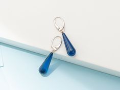 These unique Earrings are made of Precious Azure Amber. Handmade, Sterling Silver 925, Drop shaped, Blue Color. It is the perfect modern detail that will add Character to the look of a contemporary Person. PRODUCT DETAILS: ◾Color: Blue Color ◾Materials: Precious Azure Amber ◾Weight: ~ 3 gr WHERE TO FIND US? ◾Etsy: www.etsy.com/shop/AmberInnovators ◾Facebook: @AmberByMazukna ◾Instagram: @AmberByMazukna ◾Twitter: @AmberByMazukna ◾Website: www.amberbymazukna.com Blue Teardrop Fine Jewelry Earrings, Blue Sterling Silver Teardrop Pierced Earrings, Elegant Blue Hypoallergenic Teardrop Earrings, Modern Blue Long Drop Jewelry, Blue Hypoallergenic Fine Jewelry Earrings, Blue Hypoallergenic Earrings For Formal Occasions, Modern Blue Long Drop Earrings, Elegant Blue Teardrop Earrings With Lever Back, Minimalist Blue Earrings For Formal Occasions