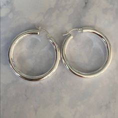 Sterling Silver 925 Plated With Rodium Hoop Earrings Thicker Hoop Round Hoop Earrings New Never Worn Smoke Free Home Last Picture For Size Elegant Hoop Earrings Stamped 925, Modern Silver Hoop Earrings With Sterling Clasp, Small Silver Hoop Earrings Hallmarked, Formal Silver Hoop Earrings Stamped 925, Silver Hoop Earrings With Shiny Finish, Classic Small Hoop 925 Silver Earrings, Silver Hoop Earrings With Sterling Silver Clasp, Sterling Silver Hoop Jewelry With Shiny Finish, Silver Huggie Earrings With Shiny Finish