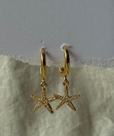 Gorgeous Boho Costal Grandma style sparkly starfish earrings beautiful for any occasion. Made to be worn alone all also to stacked.  This stunning earrings are hypoallergenic (lead and nickel free).  Perfect for everyday wear as they are Tarnish resist and waterproof,  Hoop diameter : 10mm Earrings are sold individually or as a pair  Made with Sterling silver with 18k Gildplated.  They are light weight. Easy to wear. Tarnish resist and sweat/waterproof, perfect for everyday wear.  All jewellery Grandma Style, Grandma Fashion, Starfish Earrings, Star Fish, Beach Boho, Stunning Earrings, Boho Beach, Boho Earrings, Sterling Silber