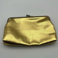 Made in the USA- high quality, nice wallet. Clean inside. 7" across by 4.5 height 6oz Formal Gold Wallets With Gold-tone Hardware, Formal Gold Wallet With Gold-tone Hardware, Evening Clutch With Card Slots In Pouch Shape, Gold Clutch With Card Slots For Evening, Elegant Gold Wallet With Coin Pocket, Elegant Gold Bags With Card Slots, Gold Evening Clutch With Card Slots, Evening Gold Clutch With Card Slots, Vintage Clutch With Gold-tone Hardware