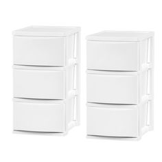 three white drawers stacked on top of each other