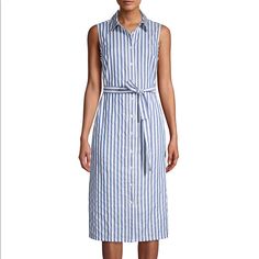 Let Them Ask You Where You Got Your Stunning Cotton Tommy Hilfiger Chambray Stripe Shirtdress. Fold-Over Collar. Sleeveless Construction. Front Button Closure. Tie At Waist. Straight Hemline. 100% Cotton. Machine Wash, Tumble Dry. Imported. Length 38 Inch Sleeveless Cotton Dresses By Tommy Hilfiger, Tommy Hilfiger Summer Beach Dress, Casual Tommy Hilfiger Day Dresses, Fitted Sleeveless Shirt Dress For Beach, Tommy Hilfiger Casual Day Dresses, Tommy Hilfiger Sleeveless Summer Dress, Fitted Sleeveless Cotton Shirt Dress, Sleeveless Cotton Shirt Dress For Daywear, Casual Fitted Sleeveless Shirt Dress