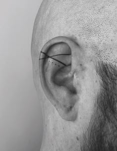 a man's ear is shown with black lines on it