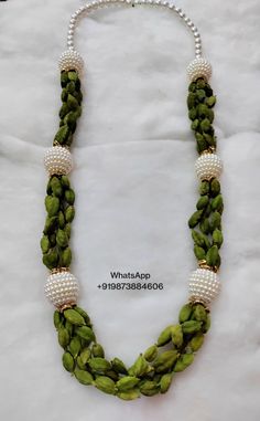 Traditional Handmade Mala As Gift, Traditional Handmade Green Mala, Handmade Green Traditional Mala, Green Bollywood Style Mala For Festivals, Handmade Mala For Celebration, Festive Green Mala For Celebrations, Green Bollywood Mala For Festivals, Handmade Mala With Round Beads For Celebration, Handmade Mala For Festivals Gift