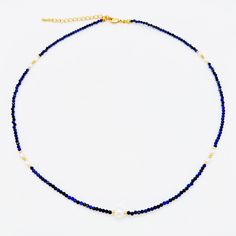 This stunning Necklace showcases the beauty of faceted Lapis Lazuli beads combined with delicate freshwater rice pearls, resulting in a truly unique and captivating design. The deep blue hue of the Lapis Lazuli beads exudes an air of timeless elegance and sophistication, perfectly complemented by the subtle charm of the freshwater rice pearls. MATERIALS: Metal: Gold Plated Brass Pearls: Natural Freshwater Pearls Stone: lapis lazuli DIMENSIONS Necklace Length: 17 inches(~43cm) + 2.5 inches extension PROCESSING & SHIPPING All of my pieces are shipped from the US, and I currently ship to customers in the US and Canada. I offer free shipping on all orders within the US. Shipping times will vary depending on your location, but I do my best to ensure that your order is shipped out as quickly as Blue Lapis Lazuli Pearl Necklace Gift, Blue Jewelry With Pearl Charm And Round Beads, Blue Necklace With Pearl Charm, Blue Necklaces With Pearl Charm And Round Beads, Pearl Necklace With Lapis Lazuli Gemstone Beads, Lapis Lazuli Gemstone Beads Pearl Necklace, Adjustable Blue Pearl Necklace With Pearl Charm, Blue Pearl Beaded Necklaces With Pearl Charm, Adjustable Blue Pearl Charm Necklace