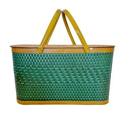 a green and yellow basket with handles on it's sides, against a white background