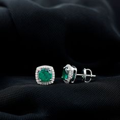 Product Details Experience the enchantment of these captivating Stud Earrings, showcasing a Round Shape Lab Created Emerald at the center, delicately held in a Prong Setting. Surrounding the vibrant created emerald is a dazzling Halo of Moissanite gemstones, adding an extra touch of sparkle. With the inclusion of a Screw Back Closure, these halo earrings ensure a secure fit, providing peace of mind. Whether for a special occasion or everyday wear, these beautiful earrings are guaranteed to elici Formal Green Diamond Cluster Earrings, Formal Emerald Earrings With Prong Setting, Gia Certified Green Diamond Earrings For Anniversary, Green Diamond Earrings With Prong Setting, Emerald Earrings With Brilliant Cut For Wedding, Emerald Earrings With Brilliant Cut For Anniversary, Green Fine Jewelry Cluster Earrings For Formal Events, Gia Certified Emerald Diamond Earrings, Elegant Round Cut Emerald Earrings