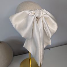 Handmade in Kate's Limerick studio in Ireland, using a weighted 22 momme 100% silk material, this hair bow is the epitome of style and grace.  This bow is oversized, draping beautifully as it sits on the head. Secured with a robust French barrette clip, once is place, this bow is going nowhere. Sucha stylish, statement piece for a bride to be or even if you just want to add a bit of glamour to your smart/casual attire. Check out my Etsy store for more luxury hair accessories. Going Nowhere, Luxury Hair Accessories, Bow Accessories, French Barrette, Luxury Hair, Silk Material, Satin Bow, Style And Grace, Barrette Clip