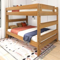 a wooden bunk bed sitting on top of a hard wood floor