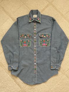 Hand embroidered permanent press chambray shirt.  Mens Small shirt size. Beautiful embroidery.  Like new. Casual Embroidered Shirt Traditional Fit, Casual Embroidered Shirt With Traditional Fit, Embroidered Cotton Button-up Shirt, Casual Fitted Shirt With Multicolor Embroidery, Fitted Casual Shirt With Multicolor Embroidery, Embroidered Cotton Shirt With Spread Collar, Cotton Embroidered Shirt With Spread Collar, Fitted Cotton Shirt With Multicolor Embroidery, Traditional Fit Embroidered Shirt For Spring