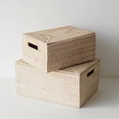 two woven storage baskets stacked on top of each other