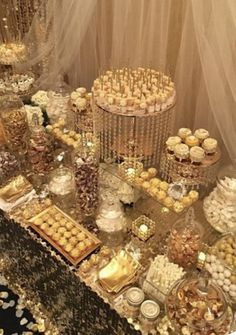 a table topped with lots of desserts and candies