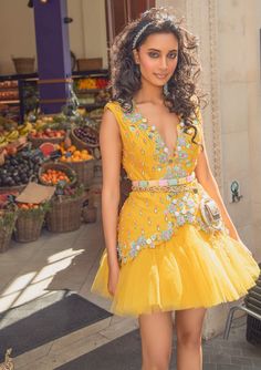 Editor's Note A Yellow Raw Silk Waistcoat Babydoll Dress With A Yellow Tulle Bottom, Embroidered With 3D Flowers, Gold Bangles, Glass Stones, Colored Beads And Pearls Note: Waist Bag Worn By Model Is For Styling Purposes Only. Color: Yellow Fabric: Raw Silk, Tulle Embroidery Details: 3D Flowers, Gold Bangles, Glass Stones, Beads And Pearls Neckline: Plunge Sleeve Type: Sleeveless Component: Dress Care: Dry Clean Only About the Designer Papa Don’t Preach By Shubhika For Girls Who Effortlessly Dis Yellow Western Dress, Elegant Royal Dresses, Yellow Waistcoat, Indian Reception Outfit, Mehandi Dress, Pride 2024, Haldi Dress, Short Frocks, Indian Reception