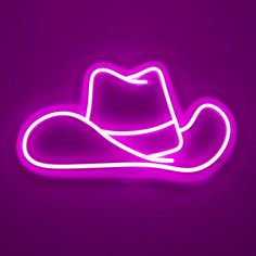 a neon sign with a cowboy hat on it