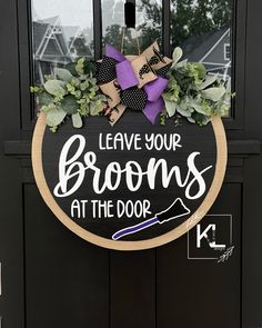 a sign that says leave your brooms at the door