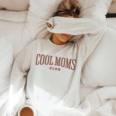 Join the Cool Moms Club with our trendy and cute sweatshirt, perfect for mothers, new moms, expecting moms, and all mothers out there! Made with comfort in mind, our sweatshirt is stylish and in vogue, making it a must-have addition to any mom's wardrobe. Featuring the fun slogan "Cool Moms Club," this sweatshirt is a statement piece that celebrates motherhood in style. It's the perfect Mother's Day gift or any occasion gift for mom. Stand out from the crowd and show off your cool mom status wit Cool Mom Club Svg, Comfy Outfits For Moms, Fun Mom Outfits, Comfortable Letter Print Sweatshirt For Loungewear, Letter Print Sweatshirt For Loungewear, Comfy Letter Print Tops For Loungewear, Comfy Tops With Letter Print For Loungewear, Cozy Fit Comfortable Tops With Letter Print, Comfortable Cozy Fit Tops With Letter Print