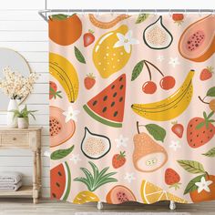 a shower curtain with fruit on it and flowers in the background, next to a chair