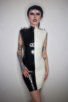 "Miserable, Darling, As Usual. Perfectly Wretched." Black and white latex mid length dress with high neck, cropped shoulders and spike detailing - Super comfortable, stretchy latex fit. - back zip for ease of putting on - Made to your sizing - Spikes customisable upon request - Length customisable upon request White Sleeveless Gothic Dress, White Fitted Gothic Mini Dress, Gothic White Mini Dress For Parties, White Gothic Mini Dress For Party, Latex Dress Halloween Costume, Dress With High Neck, Leather Outfits Women, Clothes Board, Vinyl Dress