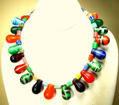 "AFRICAN Dom Dom Sele Wedding Beads CHOKER with Colorful Antique Chevron Beads, All Glass, So Colorful , Rachelle Starr OOAK Necklace This Vintage African Trade Bead Necklace features old Mali Glass DOM DOM ( light bulb shaped Wedding Beads )and old chevron tube beads in My design! This necklace is 16\" long (40.64cm ) The very old glass light bulb shaped african wedding beads ( Called DOM DOM SELE) were originally from Czechoslovakia, brought to Africa as ballast in ships and traded way back fr Multicolor Large Beads For Wedding, Multicolor Teardrop Jewelry With Spacer Beads, Bohemian Multicolor Wedding Beads, Multicolor Teardrop Dangling Beads, Multicolor Adjustable Teardrop Beaded Necklace, Multicolor Adjustable Teardrop Beaded Necklaces, Multicolor Teardrop Beaded Necklace With Adjustable Fit, Multicolor Faceted Beads For Wedding, Multicolor Faceted Wedding Beads