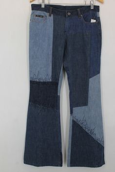 Patchwork Rigid Denim Jeans In Denim Blue, Casual Patchwork Denim Blue Flare Jeans, Patchwork Denim Blue Jeans, Distressed Blue Recycled Denim Flare Jeans, Distressed Blue Flare Jeans In Recycled Denim, Dark Wash Patchwork Denim Flare Jeans, Blue Distressed Flare Jeans In Rigid Denim, High Rise Blue Flare Jeans With Patchwork, Blue High-rise Patchwork Flare Jeans