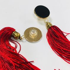 "This black and red stud tassel earrings have the chic touch for your any outfit. The earrings are made in Silk, gold plated brass and leather. Is a simple and statement design. In the top a gold plated brass stud with a leather cabochon, hanging a handmade silk tassel. Total Length 15 cm , 6 inches Ask me if you want a different colors or length ! If you want Express shipping ( Dhl delivery in 2-5 days) You'll see a drop down menu that says \"Standard Shipping \" to the right of your item. If y Elegant Red Tassel Drop Earrings, Elegant Red Tassel Earrings As Gift, Elegant Red Tassel Earrings For Gift, Red Tassel Earrings With Latkans As Gift, Red Tassel Earrings With Latkans For Gifts, Red Latkans Tassel Earrings For Gifts, Elegant Red Plug Earrings For Party, Trendy Red Jewelry For Evening, Trendy Red Tassel Earrings