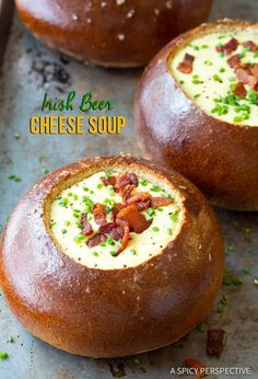 three baked bread bowls with bacon and cream in them