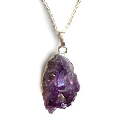 Amethyst Crystal Pendant Necklace. Multiple, natural amethyst points in a deep, dark purple give you ultimate purple perfection. Delight your neck with this whimsical, weighty chunk. Each stone is unique, so shape, clarity and size may vary. • 16" silver plate chain. Wear it close!• Lobster clasp closure• Silver electroplated base• Natural amethyst stone• Pendants average 25 mm wide, 25mm tall, 30mm thick Handmade in the USA in our Detroit, Michigan studio. This item is available for immediate s Purple Amethyst Pendant Crystal Necklace, Spiritual Purple Necklace With Large Stone, Purple Raw Stone Crystal Pendant Necklace, Purple Amethyst Necklace With Raw Stone, Purple Raw Stone Necklaces For Healing, Purple Amethyst Crystal Necklaces With Natural Stones, Purple Raw Stone Crystal Necklace For Healing, Raw Amethyst Stone Purple Crystals, Spiritual Purple Crystal Necklace With Raw Stone