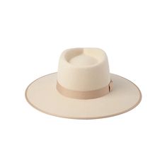 Make a statement with the Lack of Color Ivory Rancher. This stiffened wool fedora boasts a rigid crown design and a tonal grosgrain ribbon trim, elevating any outfit with its unique style. Perfect for those looking to stand out and make a bold fashion statement. Color: Ivory 100% soft Australian wool Brim Measures 10 cm / 3.95”. Grosgrain Edged Hat Rim and Bow Ribbon Detail. Classic Crown Height. UPF 50+ Images and Description Courtesy of Lack of Color Elegant White Fedora With Flat Crown, Elegant Felt Hat With Flat Crown For Spring, Elegant Spring Felt Hat With Flat Crown, Elegant Panama Hat With Flat Crown For Winter, Elegant Flat Crown Panama Hat For Winter, Elegant Beige Fedora With Flat Crown, Elegant Cream Fedora With Flat Crown, Classic Beige Panama Hat For Winter, Elegant Cream Panama Hat With Flat Crown