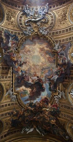 an ornate ceiling with many paintings on it